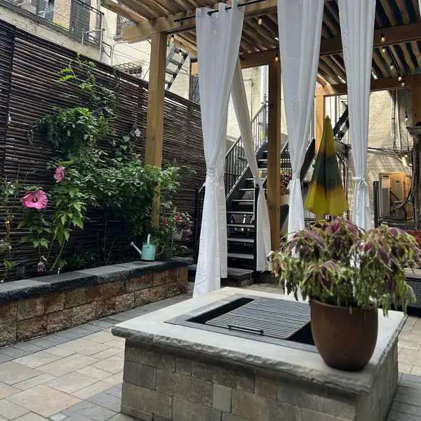 Outdoor healing garden at Park Slope Dermatology & Medi Spa in Brooklyn NY with plants, seating, and spa atmosphere